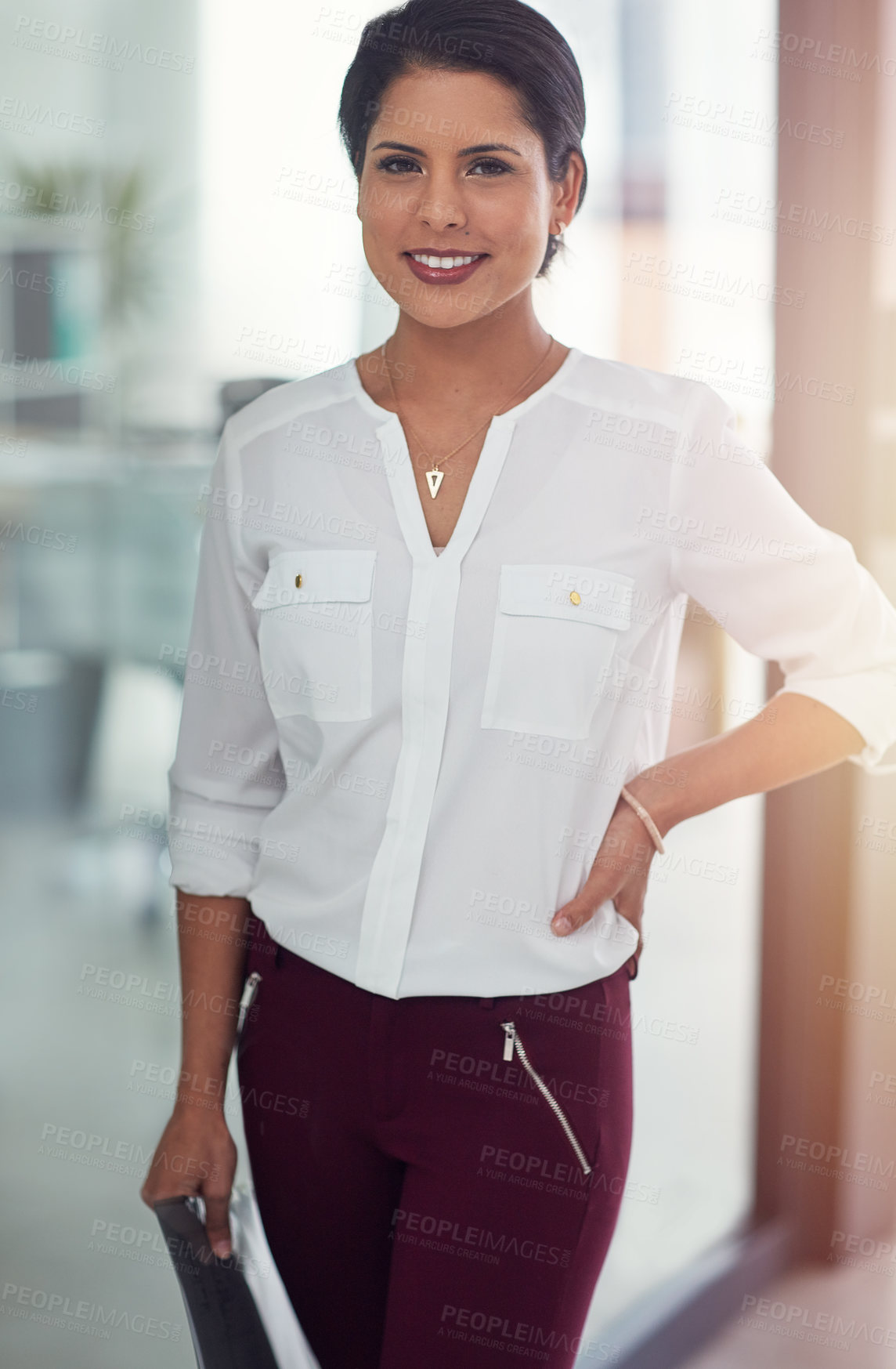 Buy stock photo Portrait of a young businesswoman standing in an office