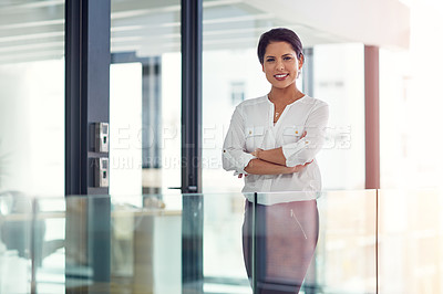 Buy stock photo Portrait of a young businesswoman standing in an office