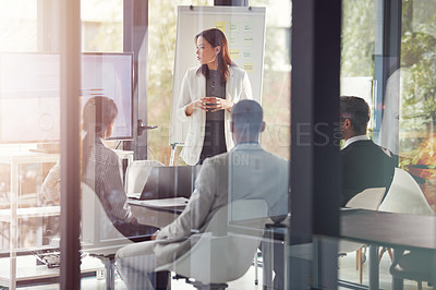 Buy stock photo Shot of a businesswoman giving a presentation in the boardroom