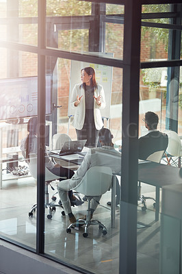 Buy stock photo Shot of a businesswoman giving a presentation in the boardroom