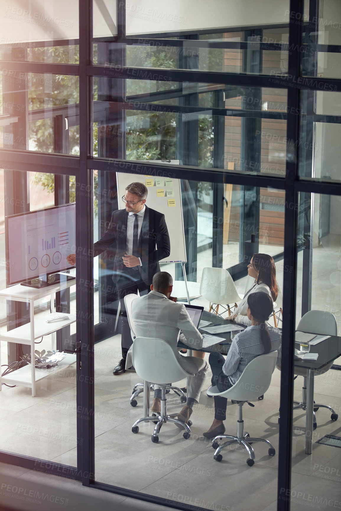 Buy stock photo Shot of a businessman giving a presentation in the boardroom