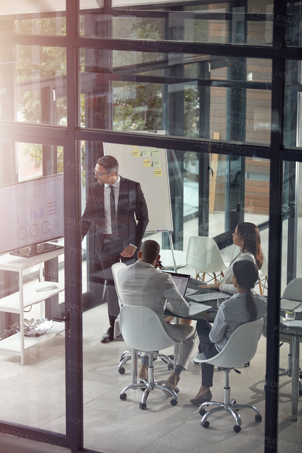 Buy stock photo Shot of a businessman giving a presentation in the boardroom