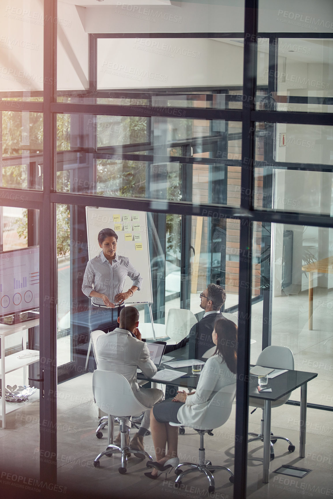 Buy stock photo Woman, presentation and planning in boardroom for team, discussion or charts at finance company. Speaker, group and business people at office meeting, above or talk with graphs at investment agency