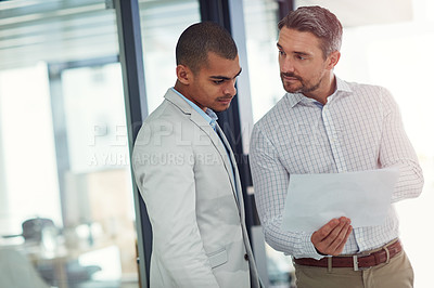 Buy stock photo Businessmen, documents and meeting with finance for company budget, expenses or proposal at office. Male people, colleagues or employees with paperwork for financial discussion, report or review