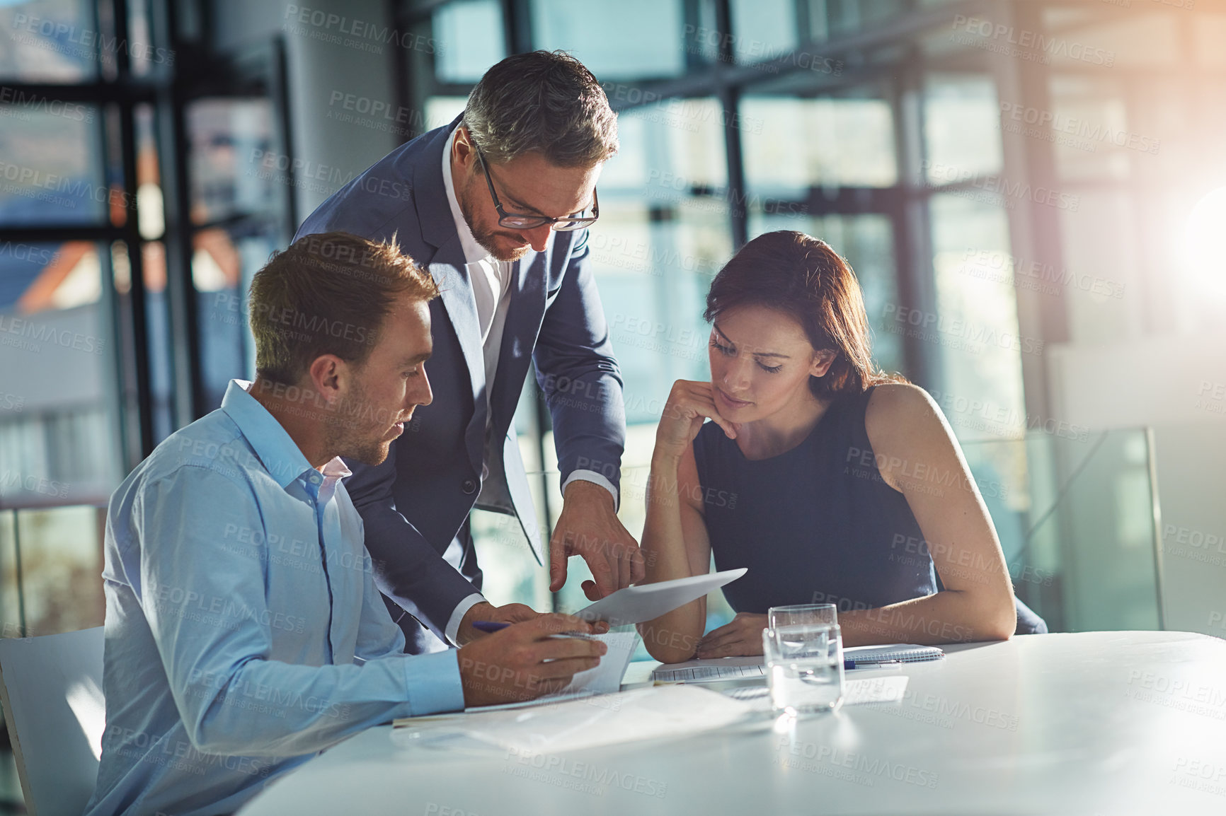 Buy stock photo Meeting, planning and business people with tablet in office for marketing strategy, ideas and online project. Teamwork, collaboration and managers sitting at desk for goals, target and our vision