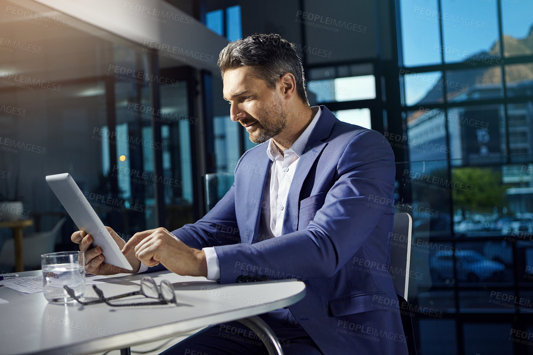 Buy stock photo Technology, modern office and businessman with tablet reading crypto data online. Financial trading, cryptocurrency and investment, man thinking at table with internet research or analytics.