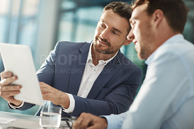 Buy stock photo Cropped shot of two businessmen meeting in the office