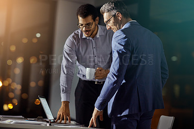 Buy stock photo Teamwork, reading and night with business people at laptop for project management, planning or web design. Collaboration, goal and documents with employee in digital agency for marketing strategy