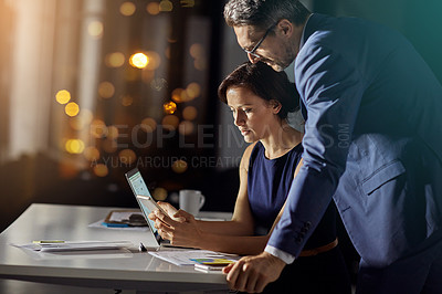 Buy stock photo Night, business and man with woman, smartphone and typing for connection, content marketing and modern office. Employees working late, manager or coworkers with tablet, conversation or online reading