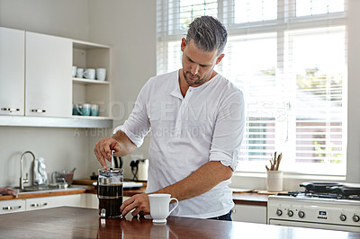 Buy stock photo Shot of a man drinking coffee in the morning at home