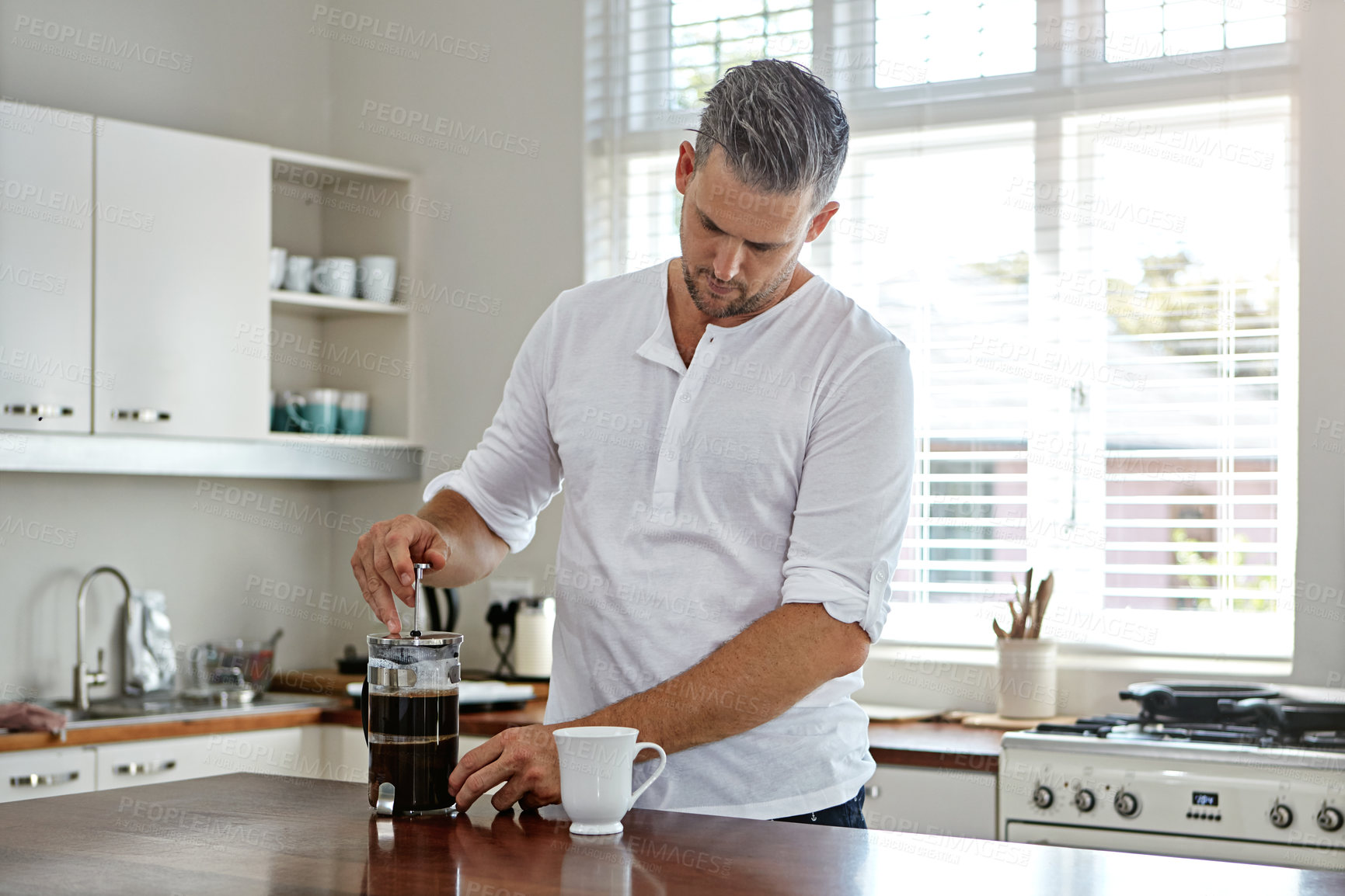 Buy stock photo Shot of a man drinking coffee in the morning at home