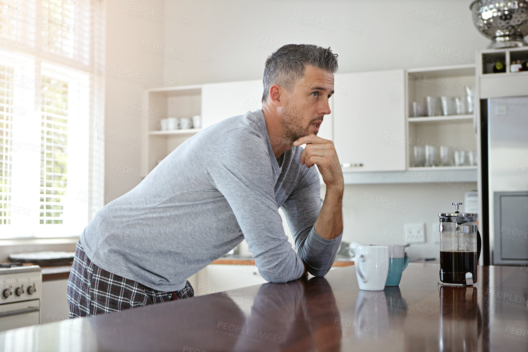 Buy stock photo Morning, thinking and man in kitchen with coffee to start day with caffeine beverage, warm drink and cappuccino. Thoughtful, home and person with French press for breakfast, latte and espresso