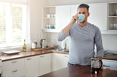 Buy stock photo Shot of a man drinking coffee in the morning at home