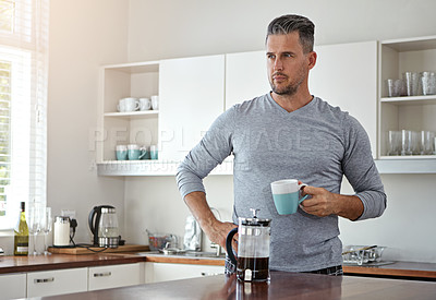 Buy stock photo Morning, thinking and man in kitchen with coffee to start day with caffeine beverage, warm drink and cappuccino. Thinking, home and person wondering by counter for breakfast, latte and espresso