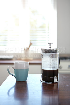 Buy stock photo Shot of a mug and french press on a kitchen counter