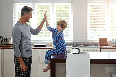 Buy stock photo Shot of a father and son enjoying some quality time at home