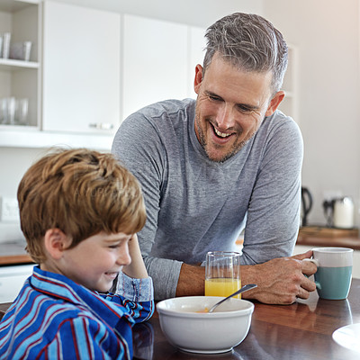 Buy stock photo Shot of a mid adult man and his son at home in the morning