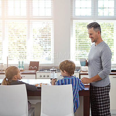 Buy stock photo Shot of a young family at home in the morning