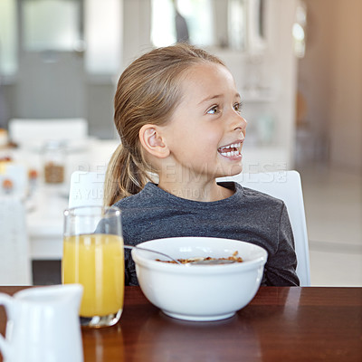 Buy stock photo Shot of a young girl having breakfast at home