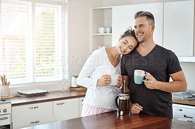 Buy stock photo Shot of a couple having their morning coffee