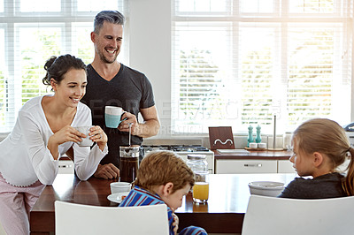 Buy stock photo Shot of a family having breakfast together