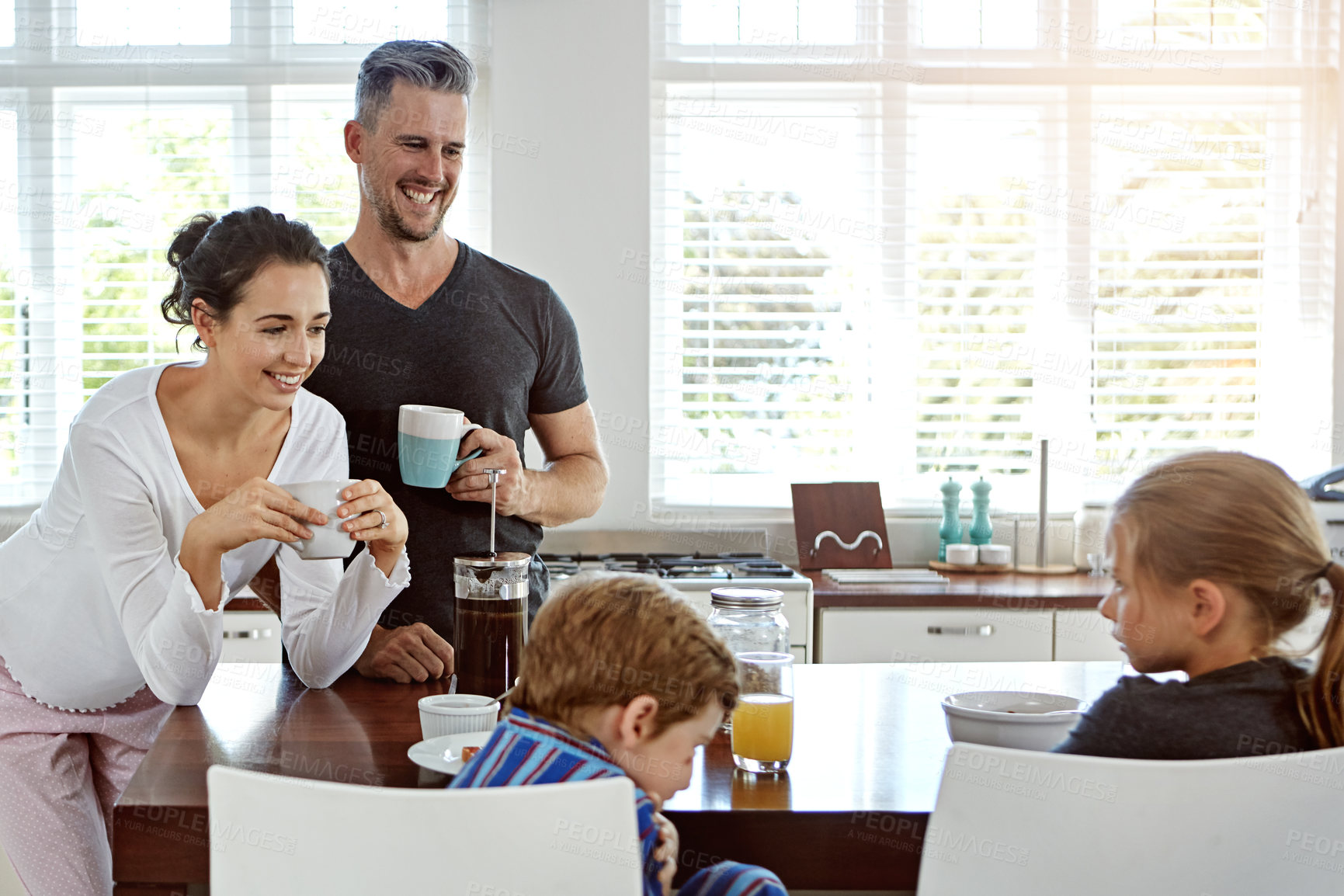 Buy stock photo Shot of a family having breakfast together