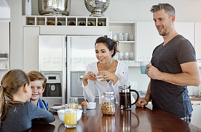 Buy stock photo Shot of a family having breakfast together