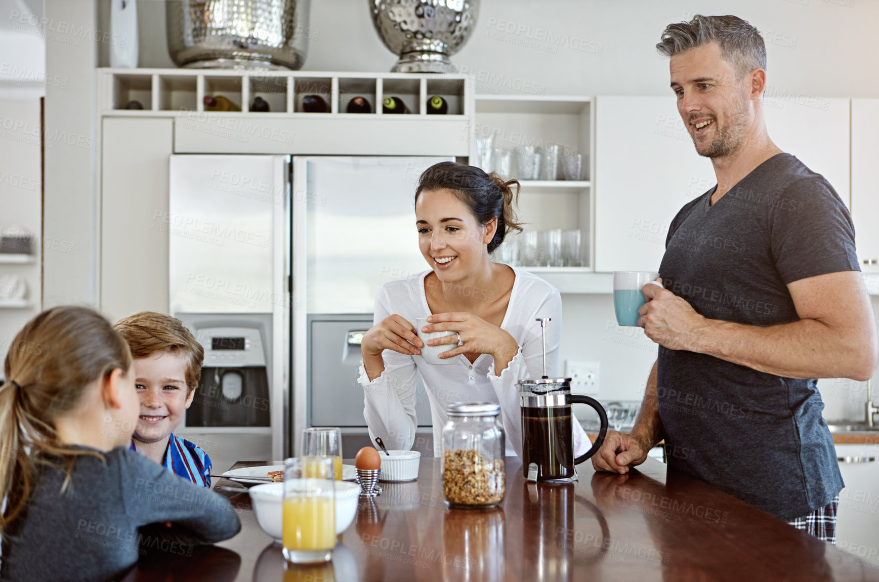 Buy stock photo Shot of a family having breakfast together