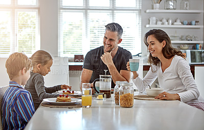 Buy stock photo Shot of a family having breakfast together