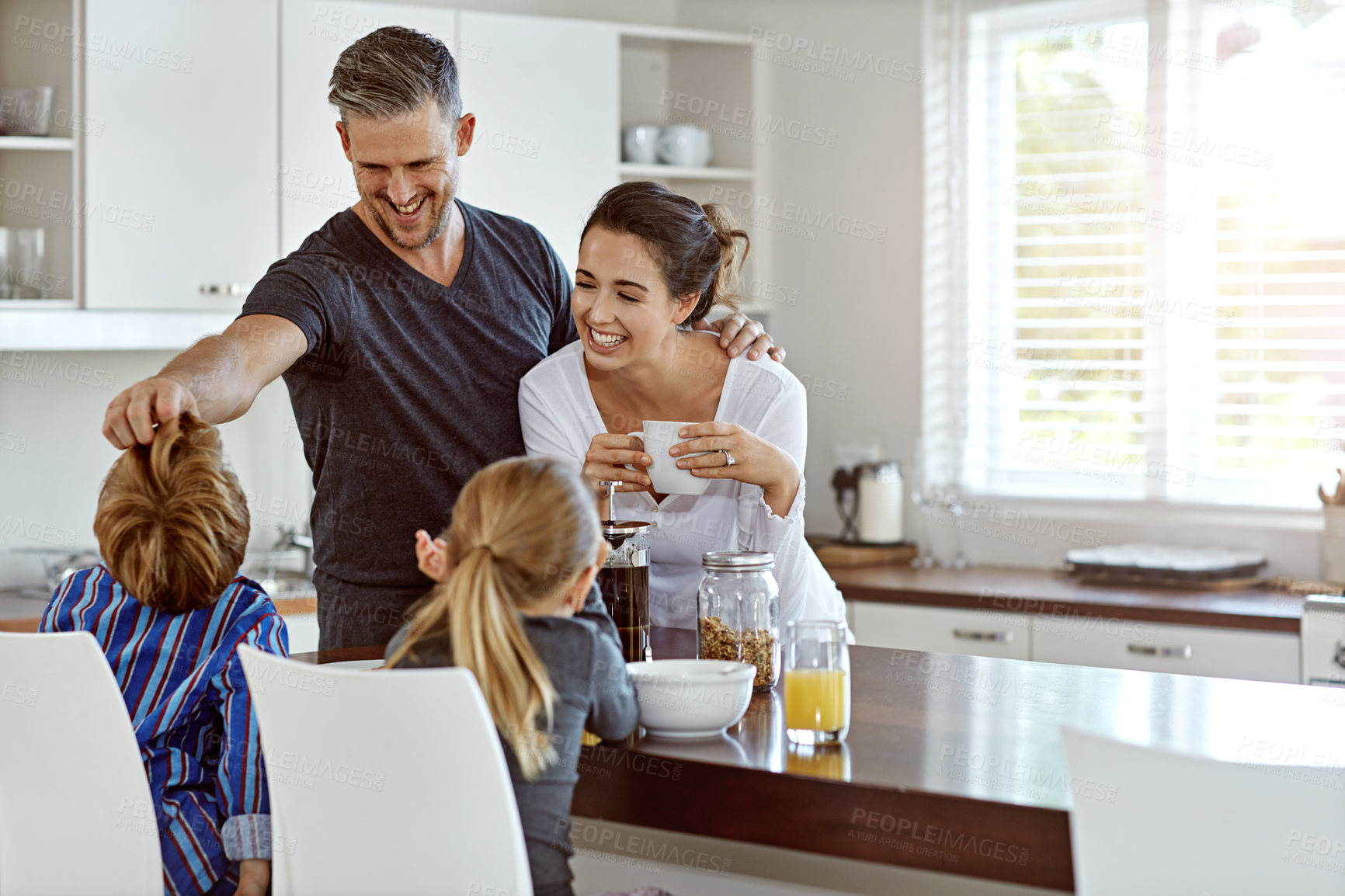 Buy stock photo Shot of a family having breakfast together