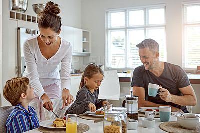 Buy stock photo Shot of a family having breakfast together