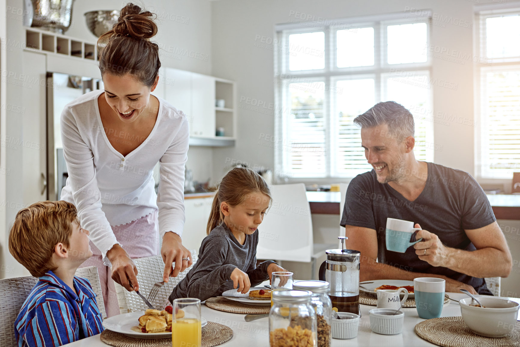 Buy stock photo Shot of a family having breakfast together