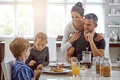 Buy stock photo Shot of a family having breakfast together