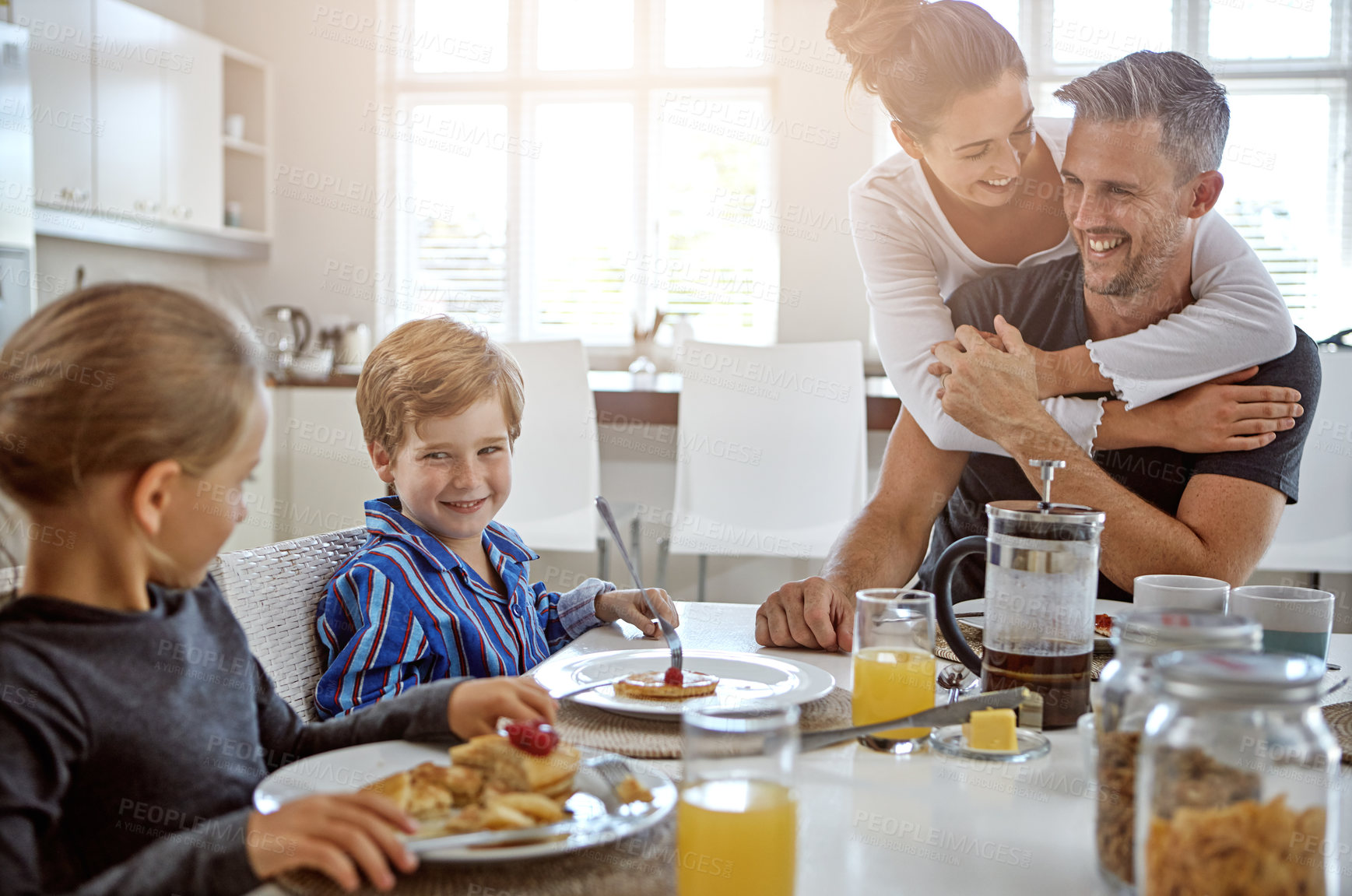 Buy stock photo Shot of a family having breakfast together