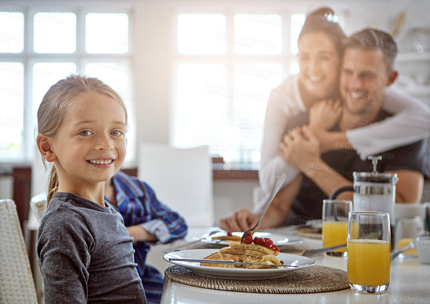 Buy stock photo Shot of a family having breakfast together