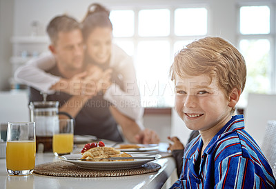 Buy stock photo Shot of a family having breakfast together