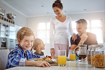 Buy stock photo Shot of a family having breakfast together