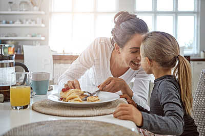 Buy stock photo Mother, child and pancakes for breakfast in a family home with love, care and happiness at a table. A happy woman and girl kid eating food in plate together in morning for health and wellness