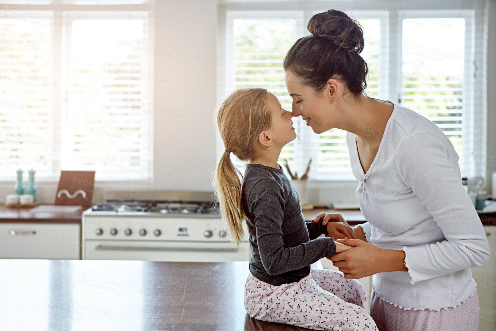 Buy stock photo Happy mother, kid and touch nose for love, care or family connection with parent in home kitchen. Smile, girl and mom holding hands with child for support, trust and bonding together with daughter