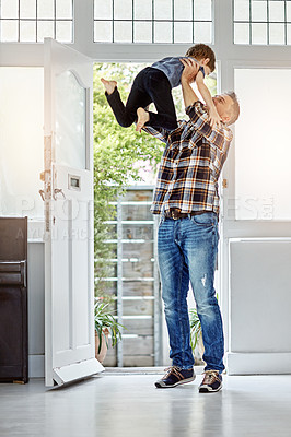 Buy stock photo Family, lifting and father with son at front door for coming home, airplane and game, happy and smile. Man, boy and excited parent return after work, greeting and hug, playing and parenthood moment