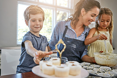 Buy stock photo Kids, cupcake or baking with mom, smile and help for bonding or dessert recipe in home. Boy, girl or mother teaching happy child cooking skills for development, learning or siblings with mixing bowl