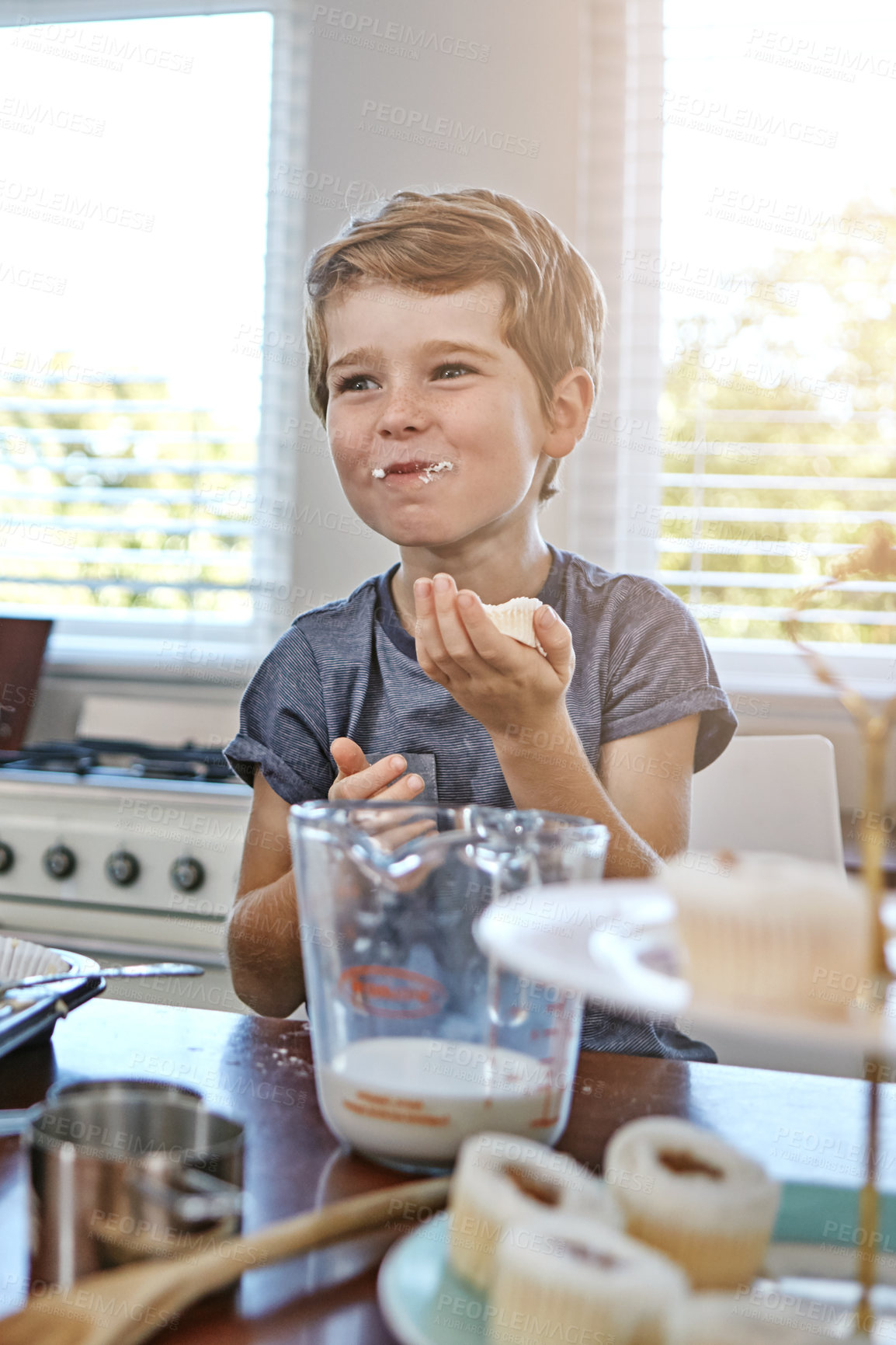 Buy stock photo Shot of a young boy in a kitchen at home