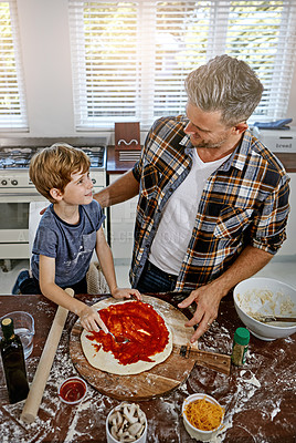 Buy stock photo Father, son and cooking or teaching with pizza, toppings and help instructions for dinner in kitchen. Happy family, man and child with food preparation in home with tomato, sauce and rolling dough