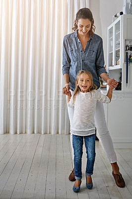 Buy stock photo Playful, happy and portrait of a mother and child with quality time in the living room of a house. Smile, happiness and girl playing with her mom in the lounge of their home together on the weekend