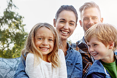 Buy stock photo Portrait of a happy family spending time together outdoors