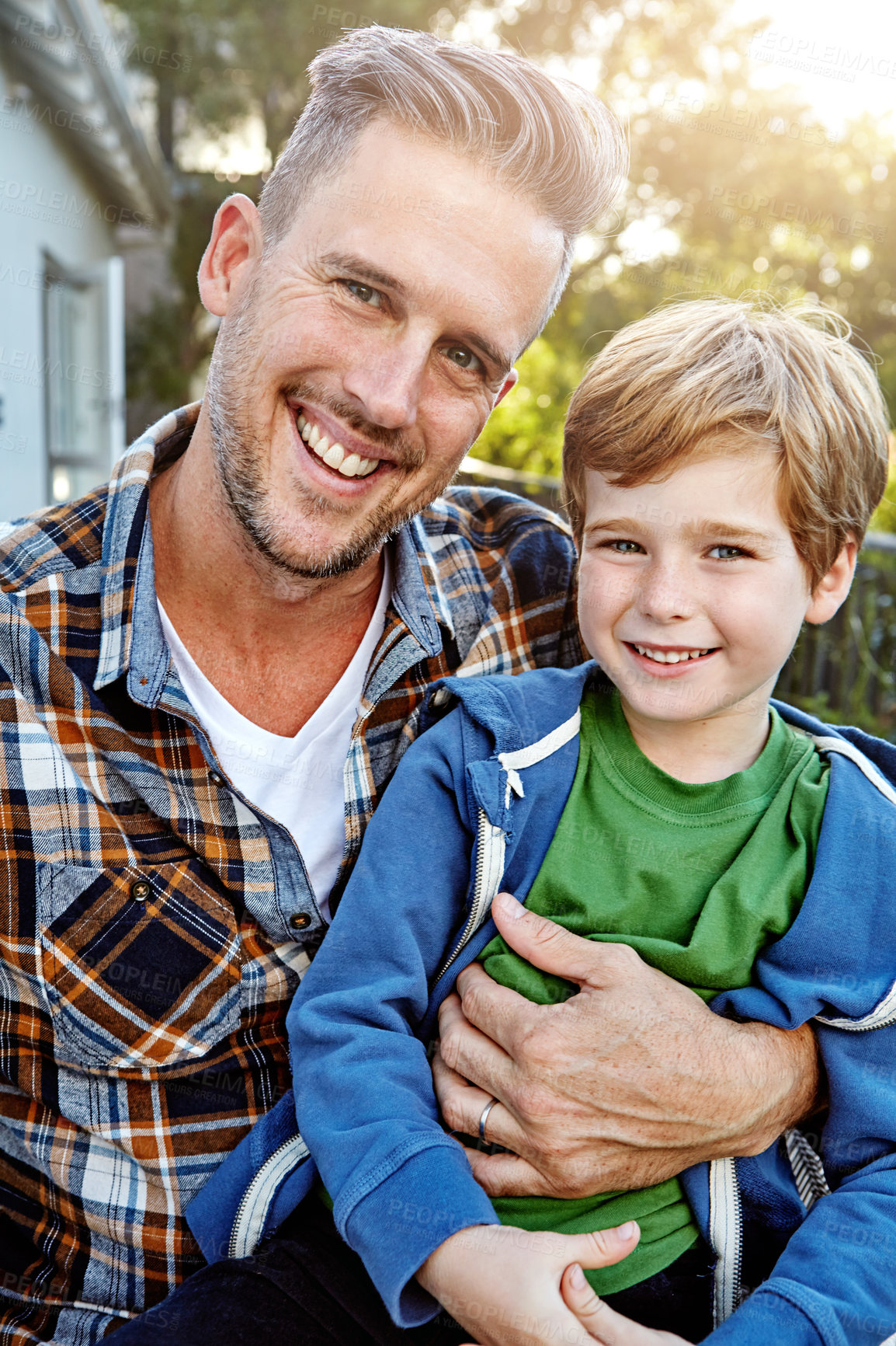 Buy stock photo Shot of a happy father and son spending time outdoors