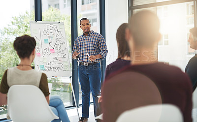 Buy stock photo Cropped shot of a young businessman giving a presentation