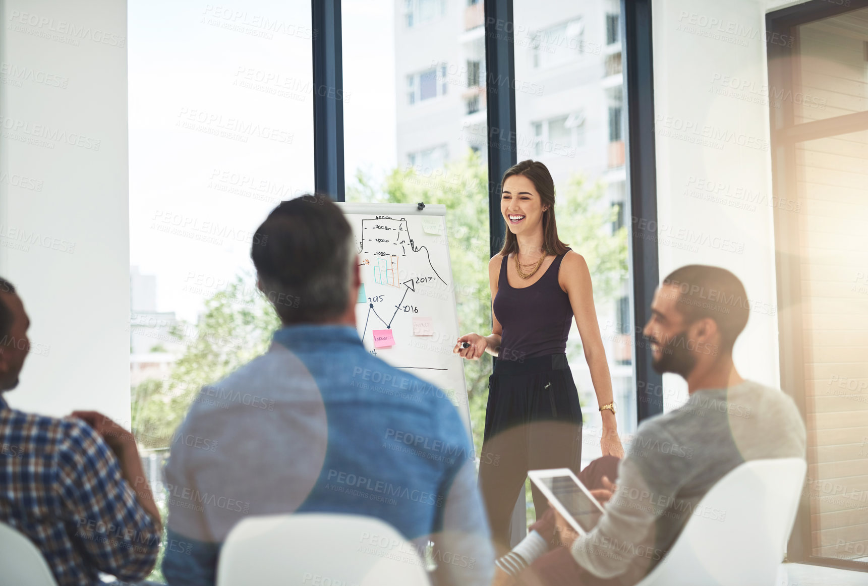 Buy stock photo Cropped shot of a young businesswoman giving a presentation