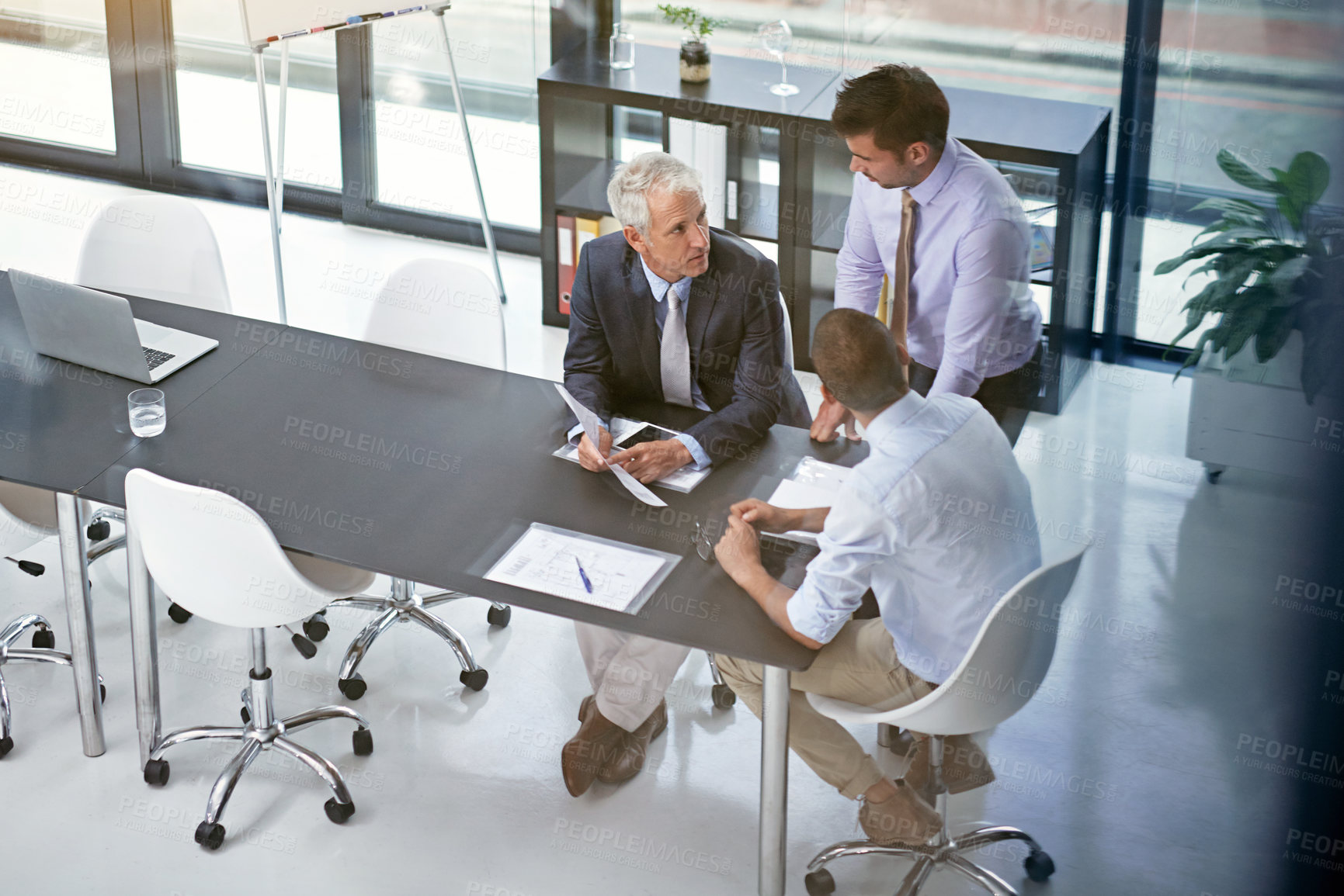 Buy stock photo Documents, meeting and planning with business people in boardroom of office together for discussion. Collaboration, management and training with employee men in corporate workplace for development