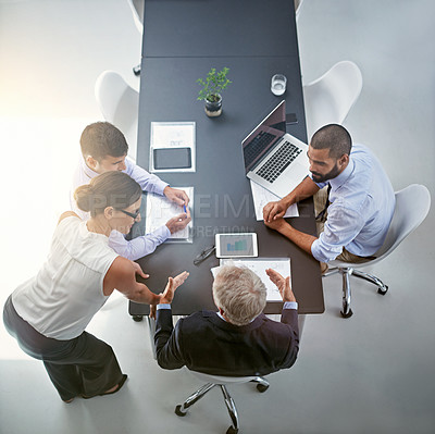 Buy stock photo Shot of corporate businesspeople having a meeting in an office